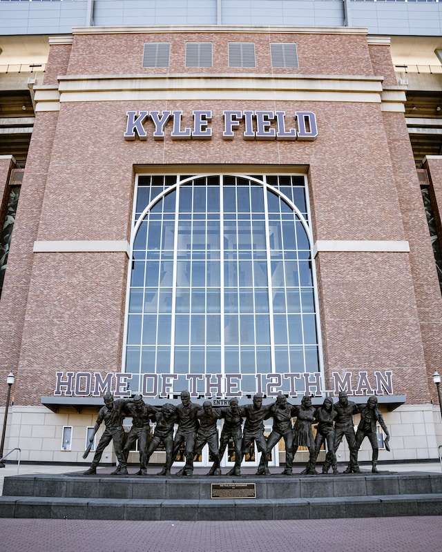 a statue of a group of men in front of a building Kyle Field, Houston Street, College Station, Texas, USA